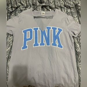 Victoria Secret Pink shirt, with a cut out on the neck.